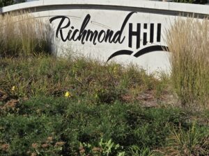 Richmond Hill 1 Richmond Hill sign at North East corner of Yonge Street ad Highway 7, looking North